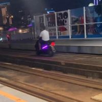Scooter spotted on elevated light rail track in southern Taiwan