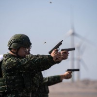 Army trains with guns on north Taiwan red beach