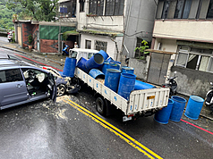 Car collides with truck carrying food waste in northern Taiwan