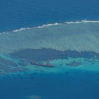 China says Philippine vessel 'illegally' landed on disputed atoll